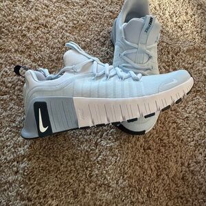 Nike women’s Light Gray and White Sneakers